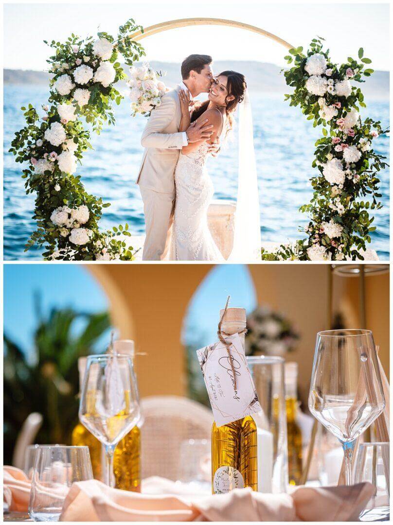 Gastgeschenke auf Tischen bei Hochzeit in Kroatien Olivenöl und Brautpaar vor Traubogen am Meer